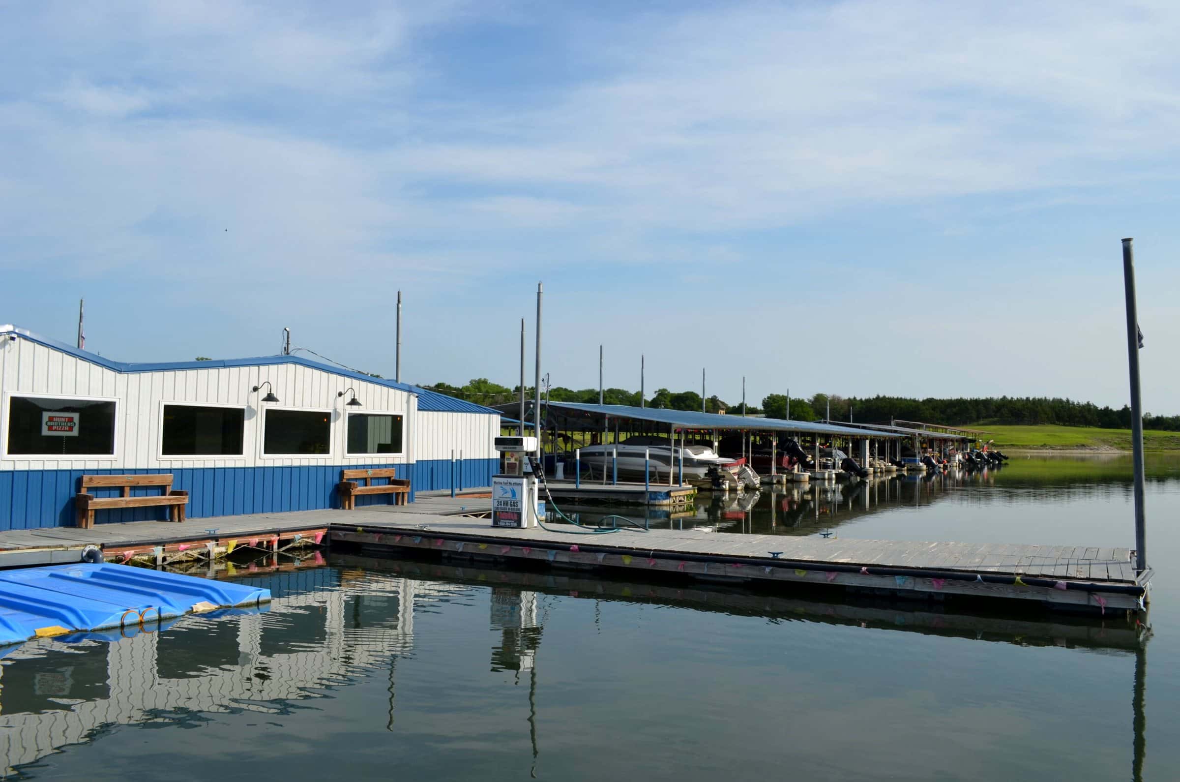 The marina store and floating jet-ski ports on still water