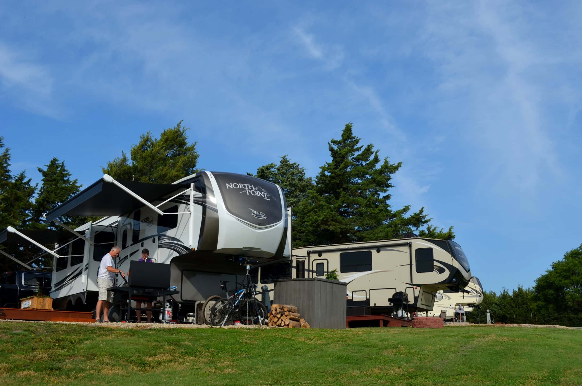 An RV set up under the trees at Thunderbird