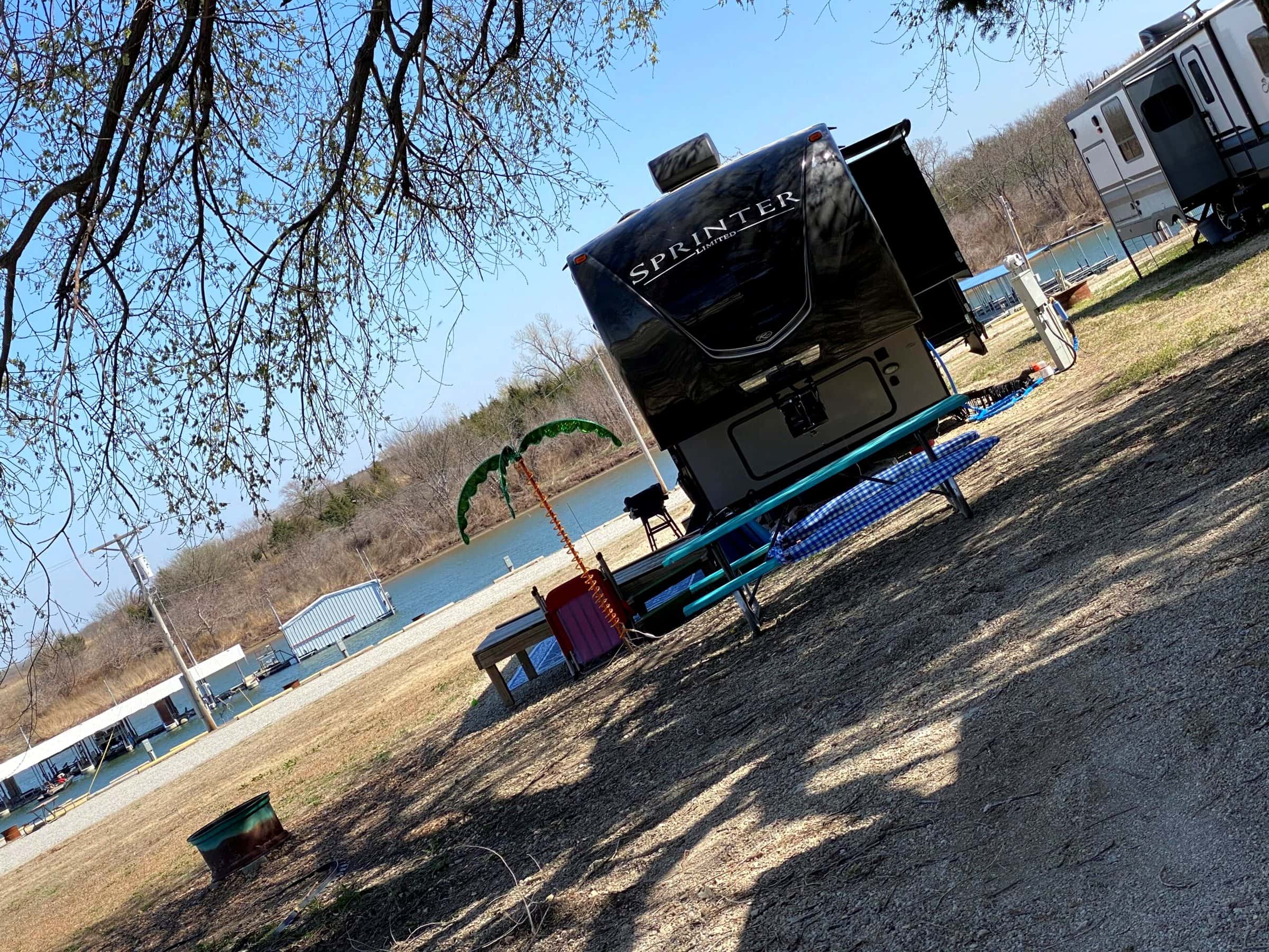 RV hooked up near the water